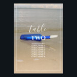 Numéro De Table Bouteille Sur La Plage Sable Mariages Nom<br><div class="desc">Ce design comprend une bouteille posée sur la plage. La belle couleur de la bouteille bleue contraste avec le sable doré, ce qui en fait un parfait assortiment. La bordure blanche et fine encadre parfaitement la bouteille bleue lavée sur le sable et correspond à la typographie moderne de couleur blanche....</div>