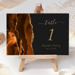 Numéro De Table Brûlé Orange Or Agate Mariage foncé<br><div class="desc">Le bord gauche de cette élégante carte de numéro de table mariage moderne comporte une bordure d'aquarelle orange brûlée,  recouverte d'une parties scintillant en faux or. Le texte personnalisable combine écriture manuscrite couleur or,  et polices italique et cuivre sur un arrière - plan noir foncé.</div>