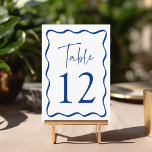 Numéro De Table Cadre de mariage ondulé bleu moderne<br><div class="desc">Ajoutez une touche élégante à votre célébration de mariage avec ces cartes de table de mariage Modern Wavy Frame ! Le design rétro affiche "Table" dans un script manuscrit bleu avec le numéro de table indiqué ci-dessous. Une bordure ondulée bleue entoure le numéro de table, contrastant avec un fond blanc....</div>