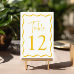 Numéro De Table Cadre de mariage ondulé jaune moderne<br><div class="desc">Ajoutez une touche élégante à votre célébration de mariage avec ces cartes de table de mariage Modern Wavy Frame ! Le design rétro affiche "Table" dans un script jaune manuscrit avec le numéro de table indiqué ci-dessous. Une bordure ondulée jaune entoure le numéro de table, contrastant avec un fond blanc....</div>