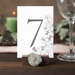 Numéro De Table Elegant Lily Floral Wedding Table Number Card<br><div class="desc">Add a graceful finishing touch to your reception tables with this elegant floral wedding table number card. Featuring delicate lily line-art illustrations along the edge, the design blends timeless botanical beauty with a clean, minimalist layout that feels both modern and sophisticated. The bold table number stands prominently at the center,...</div>