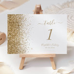 Numéro De Table Mariage blanc moderne Gold Parties scintillant Edg<br><div class="desc">Le bord gauche de ce numéro de table mariage moderne et élégant présente un style de parties scintillant en faux or. Le texte personnalisable combine écriture manuscrite couleur or pâle,  cuivre et polices italiques sur un arrière - plan blanc.</div>