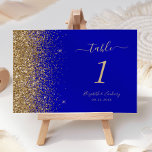 Numéro De Table Mariage de bord Royal Blue Gold Parties scintillan<br><div class="desc">Le bord gauche de ce numéro de table mariage moderne et élégant présente un style de parties scintillant en faux or. Le texte personnalisable combine écriture manuscrite couleur or pâle,  cuivre et polices italiques sur un arrière - plan bleu royal.</div>