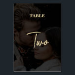 Numéro De Table Mariage de couverture photo Black Gold moderne<br><div class="desc">Un design mariage moderne en noir et or. Ce design contemporain est idéal pour les mariages du printemps, de l'été, de l'automne et de l'hiver en toute saison. Un élégant look noir 2 photo vellum superposé avec la typographie de calligraphie dorée. Un élégant design élégant de numéro de table de...</div>