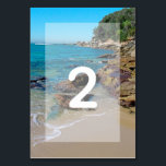 Numéro De Table Mariage de Rocky Beach<br><div class="desc">Ce complexe de plage dispose d'un littoral rocheux. Le cadre pittoresque allie verdure, océan bleu, littoral rocheux et sable doré. Le libellé est élégamment encadré d'un simple arrière - plan blanc opaque. Il s'agit de la destination parfaite de la plage conception de mariage idéal pour un mariage d'été ou de...</div>