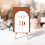 Numéro De Table Mariage de script Whimsical Terracotta Arch Frame<br><div class="desc">Design moderne et élégant imprimé Whimsical Arch Frame Terracotta Burnt Script Mariage Numéro de table qui peut être customisé avec votre texte et ajouter chaque carte numéro de table à votre panier, un par un. Cliquez sur le bouton "Customiser" et utilisez notre outil de conception pour modifier ce modèle. Découvrez...</div>