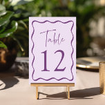 Numéro De Table Mariage de trame violet moderne<br><div class="desc">Ajoutez une touche de style à votre célébration mariage avec ces cartes de table mariage Modern Wavy Frame ! La conception rétro affiche "Table" dans un script violet manuscrit avec le numéro de tableau ci-dessous. Une bordure ondulée violet foncé entoure le numéro de table, en contraste avec un arrière -...</div>