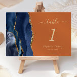 Numéro De Table Marine Blue Gold Agate Brûlé Orange Mariage<br><div class="desc">Le bord gauche de cette élégante carte de numéro de table mariage moderne comporte une bordure marine couleur aquarelle ornée d'une parties scintillant en faux or. Le texte personnalisable combine écriture manuscrite couleur or,  italique et polices de cuivre sur un arrière - plan orange brûlé.</div>