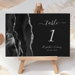 Numéro De Table Moderne Noir Argent Agate Mariage Sombre<br><div class="desc">Le bord gauche de cette élégante carte de numéro de table mariage moderne comporte une bordure en aquarelle noire,  ornée d'une parties scintillant en faux argent. Le texte personnalisable associe écriture gris argenté et polices italique et cuivre sur un arrière - plan noir ardoise.</div>