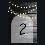 Numéro De Table Moderne Rustique Noir Bois Lumière Arc Mariage<br><div class="desc">Une belle fusion de bois rustique combiné à l'or chic moderne, lumières élégantes et arche. Un design unique qui utilise les tons noir et blanc avec une touche d'or élégant. Un design de grange de campagne rencontre le glamour de la ville. Conception de numéro de table de mariage rustique avec...</div>