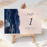 Numéro De Table Rose bleu de la marine moderne Gold Agate Mariage<br><div class="desc">Le bord gauche de cette élégante carte de numéro de table mariage moderne comporte une bordure marine bleue aquarelle ornée d'une parties scintillant en or rose faux. Le texte personnalisable combine écriture manuscrite gris fusain,  italique et polices cuivre sur un arrière - plan blush.</div>