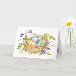Oeufs de Pâques peints dans la carte de voeux de n