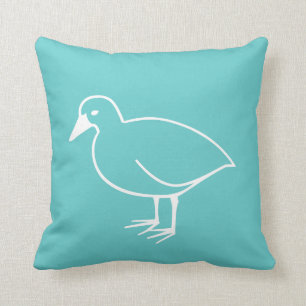 oiseau blanc sur coussin bleu turquoise