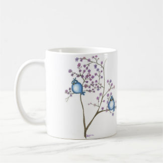 Oiseaux et tasse de fleurs