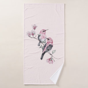 Oiseaux roses et noirs sur une branche d'arbre