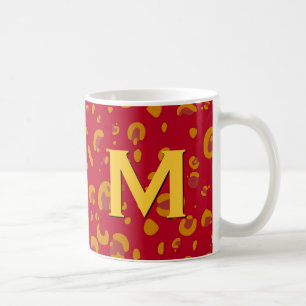 Or et tasse orange de monogramme de léopard