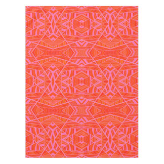 Orange sur la nappe géométrique rose de motif par