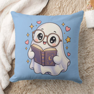 Oreiller jeté de fantôme mignon lisant un livre