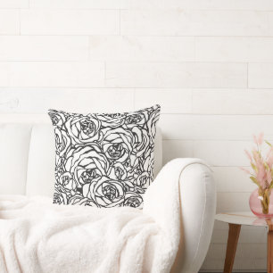 Oreiller noir et blanc à motif floral