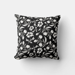 Oreiller noir et blanc à motif floral