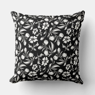 Oreiller noir et blanc à motif floral
