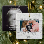 Ornement En Céramique 2 Photo Pregnancy New Parents 1st Xmas Expecting<br><div class="desc">Celebrate the precious gift of your newest family member with a stylish 2 photo square faux marble ceramic ornament. Gender neutral design is suitable for a new baby boy or girl. Wording and pictures on this template are simple to personalize. (IMAGE PLACEMENT TIP: An easy way to center a photo...</div>