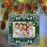 Ornement En Céramique 2 Photos Famille Hiver Végétation Noël<br><div class="desc">Ce décor de Noël carré vert foncé présente une élégante illustration de verdure d'hiver blanche qui encadre la photo horizontale. Le design offre de l'espace pour 2 photos,  l'une à l'avant et l'autre à l'arrière. Personnalisez ce joli ornement de conservation avec votre nom de famille et l'année.</div>
