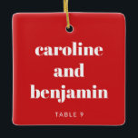 Ornement En Céramique Carte de lieu personnalisée unique Mariage de Noël<br><div class="desc">Faites de votre mariage d'hiver un événement spécial grâce à cet ornement en céramique personnalisée en rouge et blanc, doublant en tant que carte de séjour personnalisée pour vos invités. Avec son nom en typographie élégante, il sert de carte d'escorte attentionnée et de souvenir qu'ils peuvent chérir. Parfait pour un...</div>