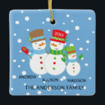 Ornement En Céramique Cute Snowman Family of 3 Christmas Ornament<br><div class="desc">Our family of 3 christmas ornament features a cute snowman couple set on a snow filled blue background!   Personalize with your information and date and you're all set to go!  Wonderful dated keepsake gift for your first christmas and a great addition to you christmas ornament collection.</div>
