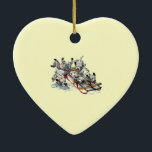 Ornement En Céramique Dalmatian Pups Sledding<br><div class="desc">Playful Dalmatian puppies sledding in the winter snow.</div>