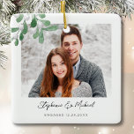 Ornement En Céramique Fiançailles Photo Noël<br><div class="desc">Cet ornement de Noël Fiançailles est décoré avec un tatouage d'aquarelle et une typographie stylisée. Facilement personnalisable avec votre photo, nom et année. Utilisez l'outil de conception pour modifier la taille, le style ou la couleur du texte. Parce que nous créons notre oeuvre, vous ne trouverez pas cette image exacte...</div>