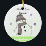 Ornement En Céramique Frosty Snowman World's BestTeacher<br><div class="desc">Un mignon bonhomme de neige dans une tenue de casquette et d'écharpe,  des flocons de neige tombent. Un message pour le meilleur professeur du monde.</div>