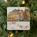 Ornement En Céramique Joyeux et lumineux Photo de famille personnalisée<br><div class="desc">Célébrez la saison festive avec notre joyeux et brillant personnage de la famille Photo de Noël en céramique ornement. Cet ornement capte la chaleur et la joie de Noël avec un design simple mais moderne qui présente des couleurs chaudes et contemporaines. Parfait pour ajouter une touche personnalisée à votre décor...</div>