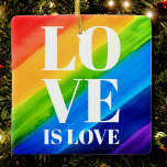 Ornement En Céramique L'amour est l'amour Gay pride arc-en-ciel<br><div class="desc">L'amour est l'amour. Célébrez l'amour,  l'égalité et le mois de la fierté de juin. Cet ornement Pride est décoré de rayures arc-en-ciel et de la typographie blanche élégante sur un arrière - plan arc-en-ciel d'aquarelle de rouge,  orange,  jaune,  vert,  bleu et violet. Aquarelle originale © Michele Davies.</div>