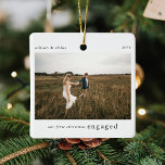 Ornement En Céramique Notre 1er Noël Engagé Photo Keepsaké<br><div class="desc">Un élégant ornement photo de Noël arboré avec la typographie classique "Nos premiers noël engagés" en noir sur un arrière - plan blanc simple et propre. La photo, le texte, le nom et l'année peuvent être facilement customisés pour rendre cet ornement unique et personnel pour vous. Un design de Noël...</div>