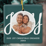 Ornement En Céramique Our 1st Christmas Engaged Photo Green Keepsake<br><div class="desc">This keepsake First Christmas Engaged photo ornament is decorated with the word JOY in stylish script typography on a green background. Easily customizable.</div>