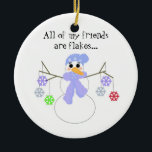 Ornement En Céramique Snowman avec Flakey Friends<br><div class="desc">Un design mignon avec un bonhomme de neige aux bras de brindilles tenant un tas de flocons de neige colorés...  dit "tous mes amis sont des flocons"... </div>