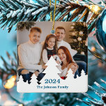 Ornement En Céramique Superposition de l'arbre de Noël Photo de famille<br><div class="desc">Cette photo de famille chic et moderne à double face ornement de Noël comprend votre photo de vacances annuelle encadrée par une bordure inférieure de silhouette d'arbres blancs de Noël. Personnalisez avec le script bleu de l'année sur le devant et votre nom pour un beau cadeau de Noël avec une...</div>