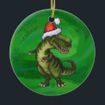 Ornement En Céramique TRex à Santa Hat sur Green<br><div class="desc">Animal Parade Festive Tyrannosaurus Rex à Santa Hat design présente notre mignon T-Rex portant un chapeau de Père Noël rouge sur sa tête et sur certains des produits, le dino du dos portant une couronne de saint avec un arc rouge vif sur un arrière - plan vert avec notre texture...</div>