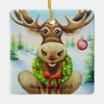 Ornement En Céramique Whimsical Winter Christmas Moose Watercolor Art<br><div class="desc">"Christmas Moose" Aquarelle Art céramique Ornement de l'artiste Jean Weiner "Christmas Moose" présente un orignal d'hiver fantaisiste prêt à célébrer Noël. L'orignal porte une couronne fraîche de verdures saintes autour de son cou. La couronne a des baies rouges et un arc rouge vif. Il y a un ornement rond, rouge,...</div>