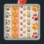 Ornement En Métal Paw Prints cute Dog Lovers<br><div class="desc">Design with a cute pattern of dog paw prints in orange and yellow and warm colours. This design looks as though a dog has walked over the product ! For dog lovers everywhere.</div>