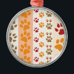 Ornement En Métal Paw Prints cute Dog Lovers<br><div class="desc">Design with a cute pattern of dog paw prints in orange and yellow and warm colours. This design looks as though a dog has walked over the product ! For dog lovers everywhere.</div>