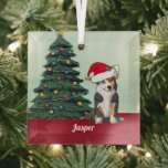 Ornement En Verre Corgi Tricolor mignon avec Queue<br><div class="desc">Ce beau tricolore Pembroke Welsh Corgi chien a un mignon casquette du Père Noël et une adorable queue. Le chiot est assis devant un joli sapin de Noël orné de décorations colorées. Personnalisez le nom de votre animal de compagnie dans une jolie cursive sous le magnifique dessin de mon chien...</div>