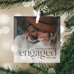 Ornement En Verre Notre première photo personnalisée de Noël<br><div class="desc">Un élégant gardien de votre année fiançailles,  ce bel ornement en verre affiche une photo préférée avec "notre premier fiancé de Noël" recouvert d'une riche lettre de prune accentuée d'étoiles. Personnalisez avec vos initiales et l'année.</div>