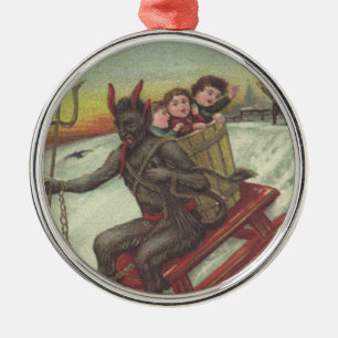 Ornement Métallique Krampus enlève des enfants avec sa fourche de traî