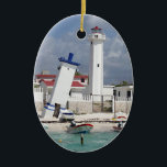 Ornement Ovale En Céramique Porto Morelos Lighthouse<br><div class="desc">Ornement en céramique ovale avec l'image d'un phare et d'une tour penchée à Puerto Morelos,  Quintana Roo,  Mexique. Revers rouge. Voir la collection complète de l'Ornement du Mexique dans la section HOME.</div>