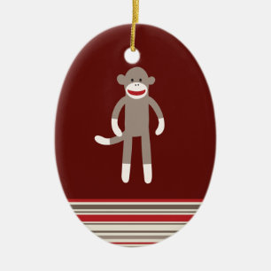 Ornement Ovale En Céramique Singe mignon de chaussette sur le rouge avec des
