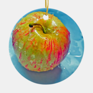 Ornement Rond En Céramique Apple rougeoyant