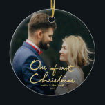 Ornement Rond En Céramique Notre premier Noël | Noël Lettré à la main<br><div class="desc">Un beau cadeau de Noël pour les jeunes mariés. Cette saison des Fêtes, envoyez cette belle photo ornement de Noël aux jeunes mariés pour commémorer leur mariage. L'ornement présente " Our First Christmas " dans une belle police en faux or lettré à la main avec espace pour une photo. Personnalisez...</div>