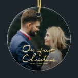 Ornement Rond En Céramique Notre premier Noël | Noël Lettré à la main<br><div class="desc">Un beau cadeau de Noël pour les jeunes mariés. Cette saison des Fêtes, envoyez cette belle photo ornement de Noël aux jeunes mariés pour commémorer leur mariage. L'ornement présente " Our First Christmas " dans une belle police en faux or lettré à la main avec espace pour une photo. Personnalisez...</div>